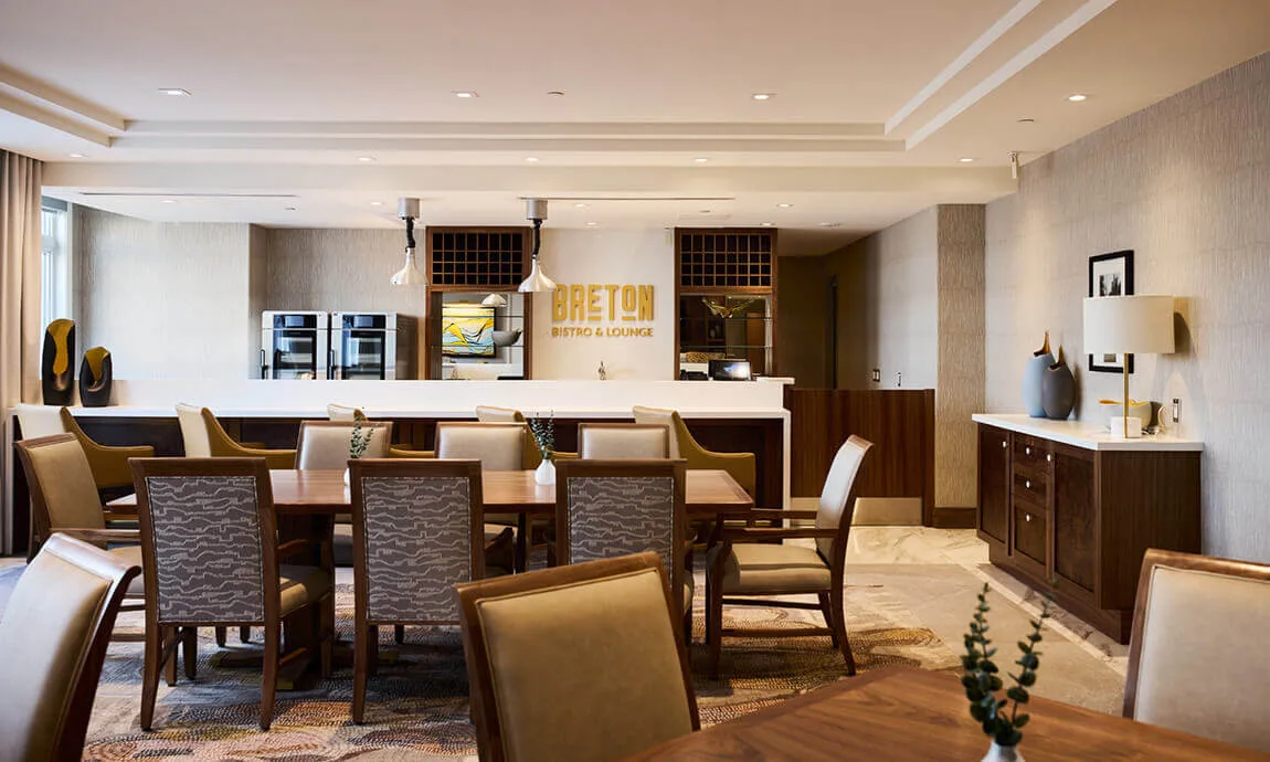 Dining area with a fitted bar and display cabinetry at Parkland Ancaster