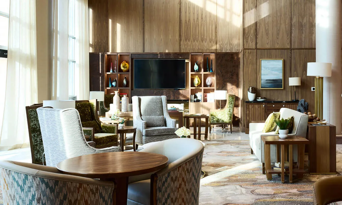 Wood-paneled lounge with built-in display shelves and media cabinetry at Parkland Ancaster